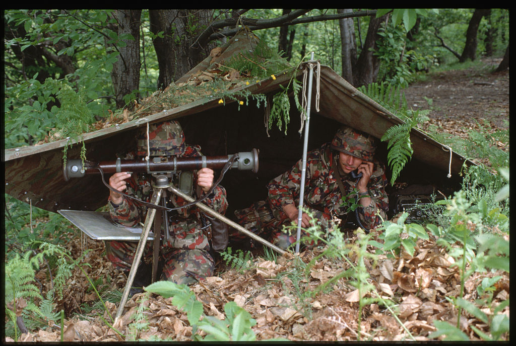 Swizz soldiers in an observation post while on exercise in Switzerland. (Photo by © Vittoriano Rastelli/CORBIS/Corbis via Getty Images)