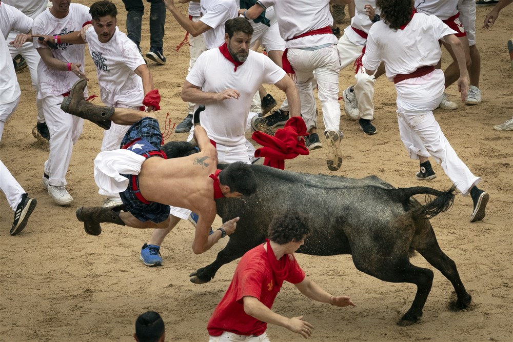 The northern Spanish city of Pamplona on Thursday marked the start of its iconic nine-day Running of the Bulls festival with the ceremonial launching of a firework known as the "chupinazo". (EPA-EFE/VILLAR LOPEZ)
