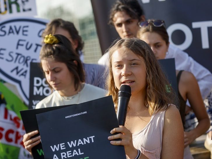 Farmers have faced off against teenage green activist Greta Thunberg outside the European Parliament in Strasbourg over planned restrictions on environmental damage. (EPA-EFE/JULIEN WARNAND)