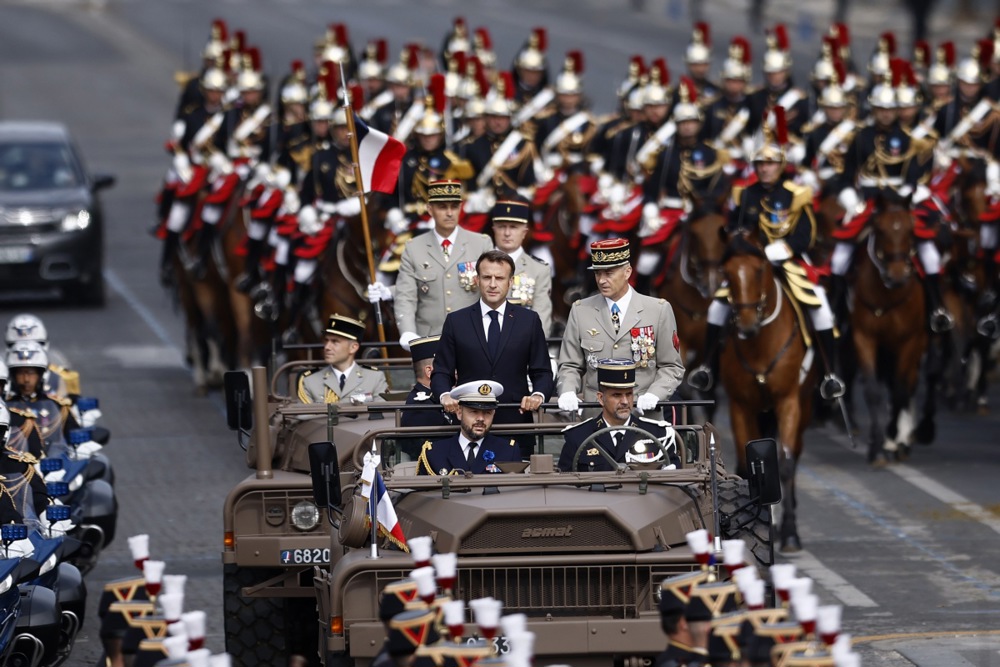France's military was in full show on July 14 as troops paraded down the Champs-Élysées to celebrate Bastille Day. (EPA-EFE/YOAN VALAT)