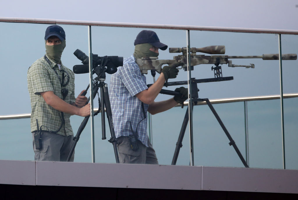 (Presumably real) snipers from the Russian Federal Protective Service. The French government has warned the general public to be aware of a financial scam involving fake hitmen. (Photo by Mikhail Svetlov/Getty Images)