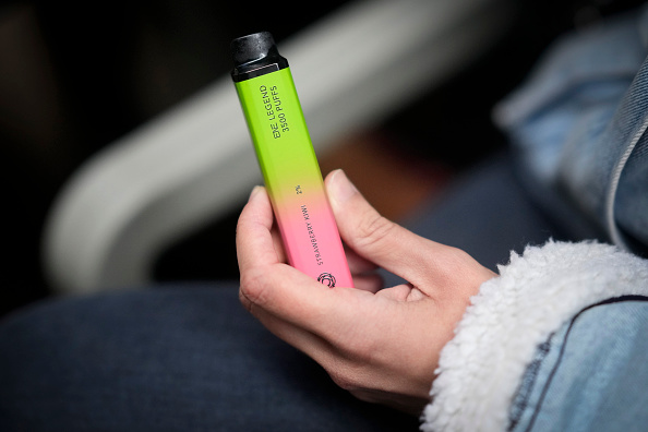 MANCHESTER, ENGLAND - MAY 30: A woman holds a vaping device on May 30, 2023. (Photo by Christopher Furlong/Getty Images)