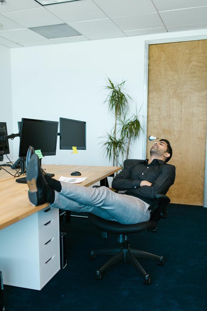 Man sleeping at the office via RDNE Stock project