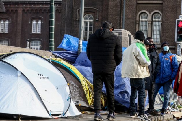 Migrants have declared they will ignore a court order to abandon their squat in the centre of Brussels. (EPA-EFE/STEPHANIE LECOCQ)
