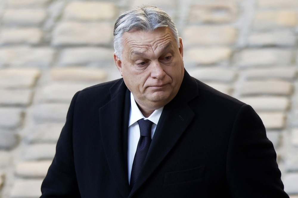 Hungarian President Viktor Orbán made a surprise appearance at a farmers' protest in Brussels ahead of a crucial EU summit on the Ukraine war. (EPA-EFE/YOAN VALAT)
