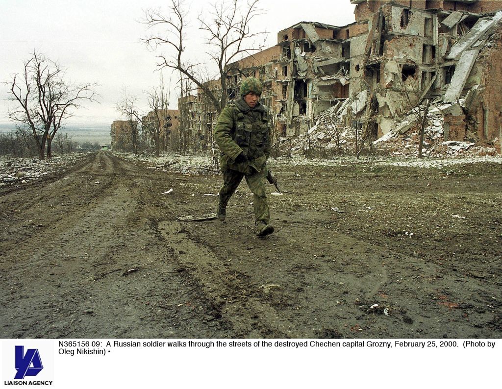 Russian soldier in Grozny Feb 2000 shows that the way to win a war is to destroy everything (Photo by Oleg Nikishin)