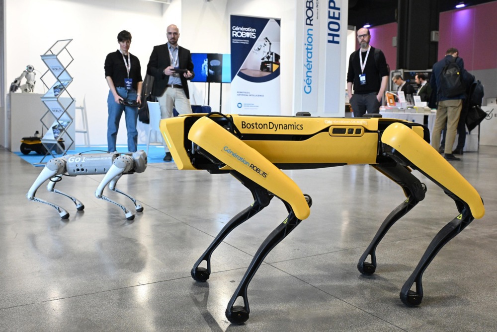 Robot dogs presented in one of the stands of the first edition of the AI Festival - Exploring Generative AI in Milan, Italy, 14 February 2024. (EPA-EFE/DANIEL DAL ZENNARO)