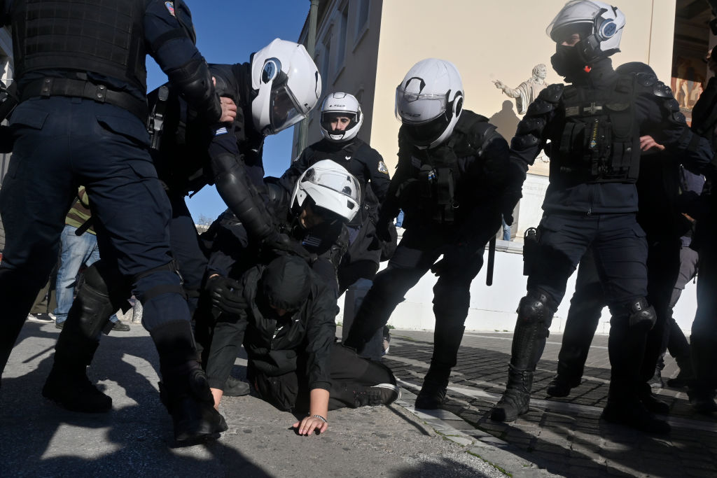 The Greek police, now ready to kick your door in if you want to publish an uncomfortable fact (Photo by Milos Bicanski/Getty Images)