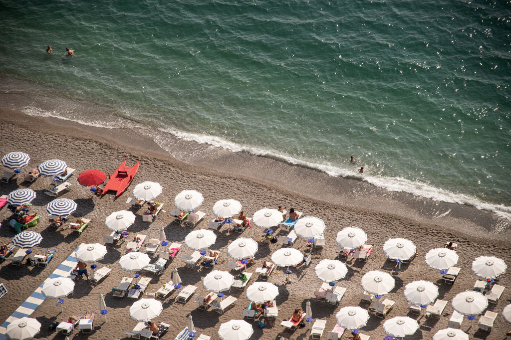 Italy's balneari (beach managers) closed their umbrellas for a few hours on August 9 in a symbolic protest against the government's failure to resolve a dispute with the European Union about opening up their business to outside competition.(Photo by Ivan Romano/Getty Images)