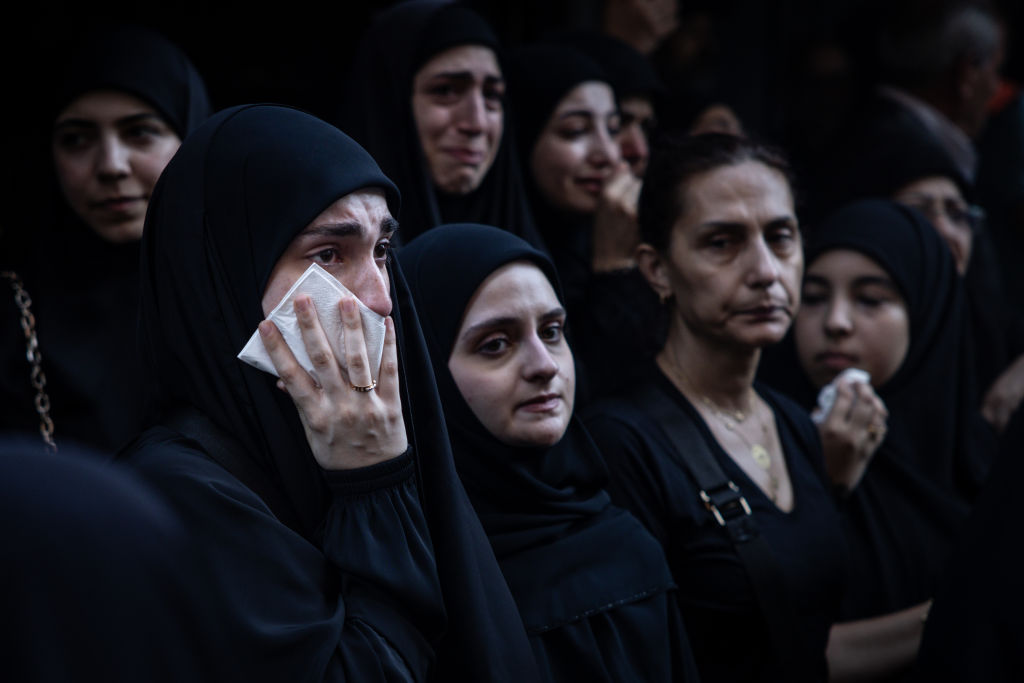 Will it ever stop? Each side buries its dead, yesterday, today, tomorrow (Photo by Chris McGrath/Getty Images)