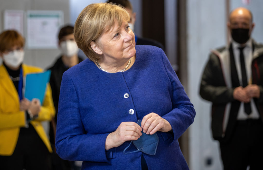 Angela Merkel, who dumped nuclear power, opened the borders to mass migration, solidified German dependence on Russian gas, but really it was all the fault of the disappointing Germans. (Photo by Andreas Gora-Pool/Getty Images)