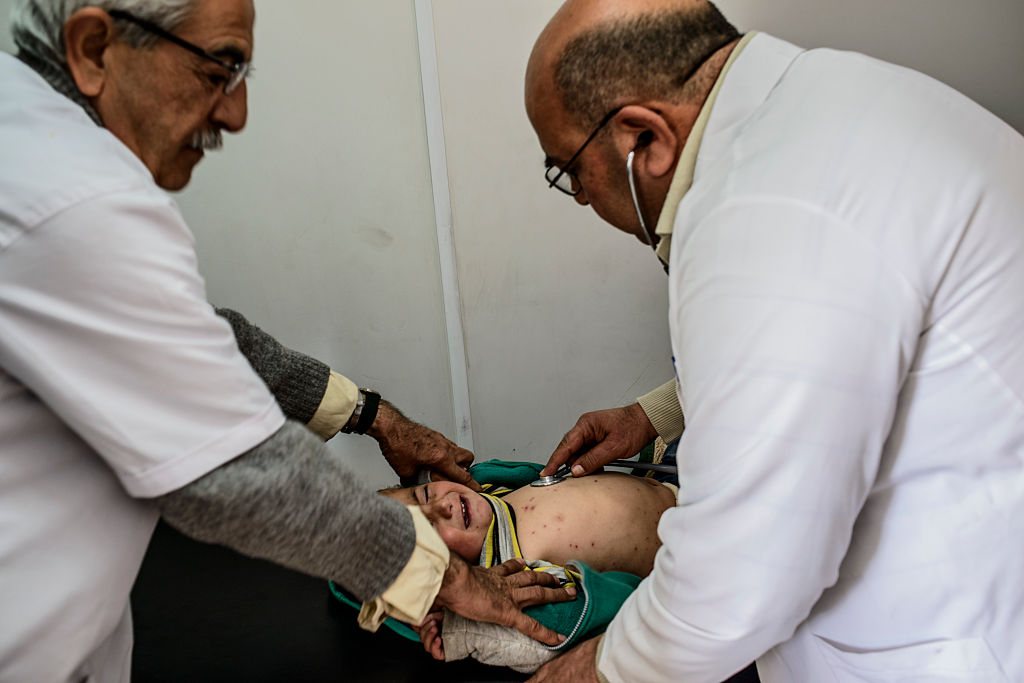 Germany’s healthcare system faces a potential crisis as reports suggest thousands of Syrian doctors working in the country are considering returning to their homeland. (Photo by Martyn Aim/Corbis via Getty Images)