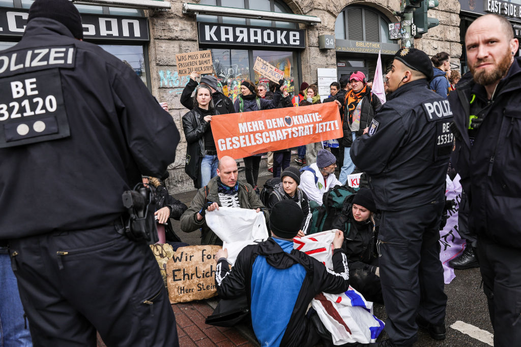 Last Generation under police watch after trying to block Warschauer Bruecke bridge on March 16, 2024 in Berlin. (Omer Messinger/Getty Images)