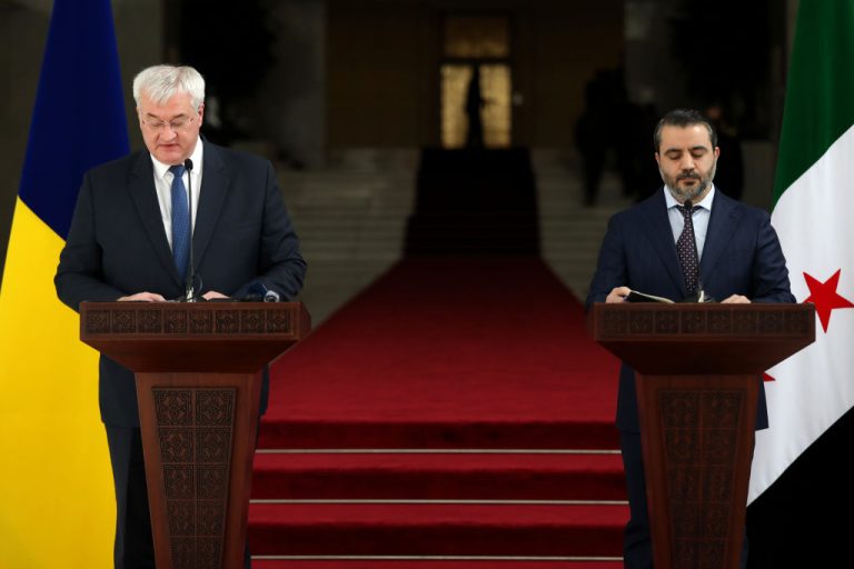 Ukrainian foreign minister Andrii Sybiha (L) and Syria's newly appointed foreign minister Asaad Hassan al-Shibani. (Ali Haj Suleiman/Getty Images)