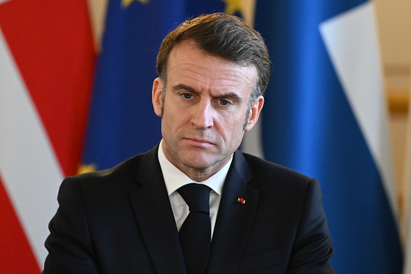 French President Emmanuel Macron faces criticisms from both the Left and Right following his 13-minute speech on Russian threats and new geopolitical order while Russia warned of the "abyss of war." (Photo by Justin Tallis - WPA Pool/Getty Images)