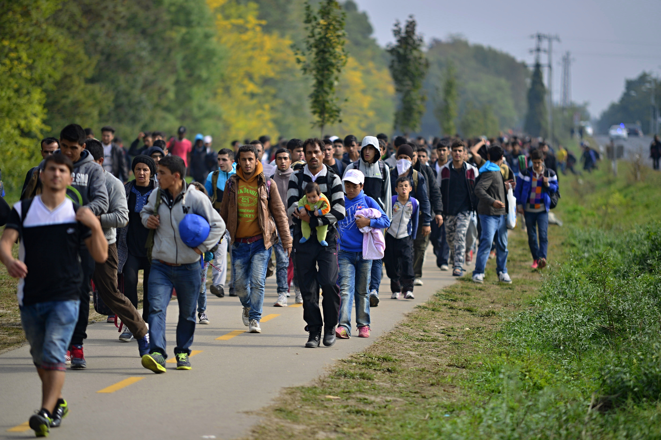 A group of Syrian refugees on their way to Germany and Austria in 2015. (Photo by Radek Proscyk / Getty)