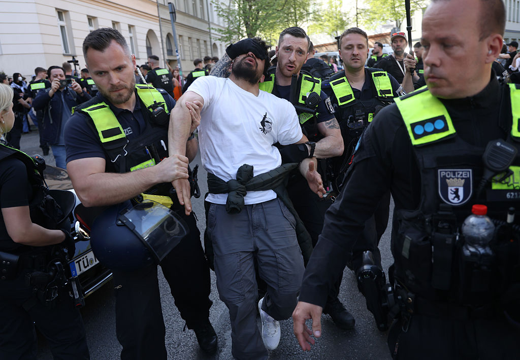 Police detain a pro-Palestine activist at Humboldt University. (Sean Gallup/Getty Images)