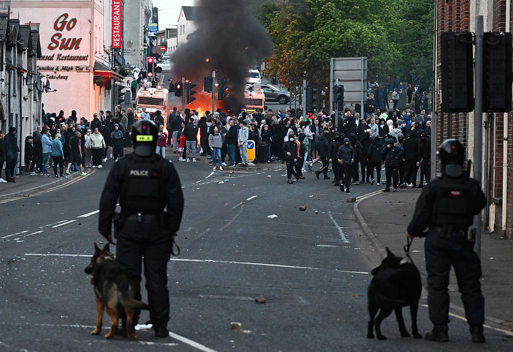 For the second night in a row, the Northern Irish town of Ballymena faced chaos as masked rioters clashed with police, setting cars and homes on fire, showing outrage over an alleged sexual assault. (Photo by Charles McQuillan/Getty Images)