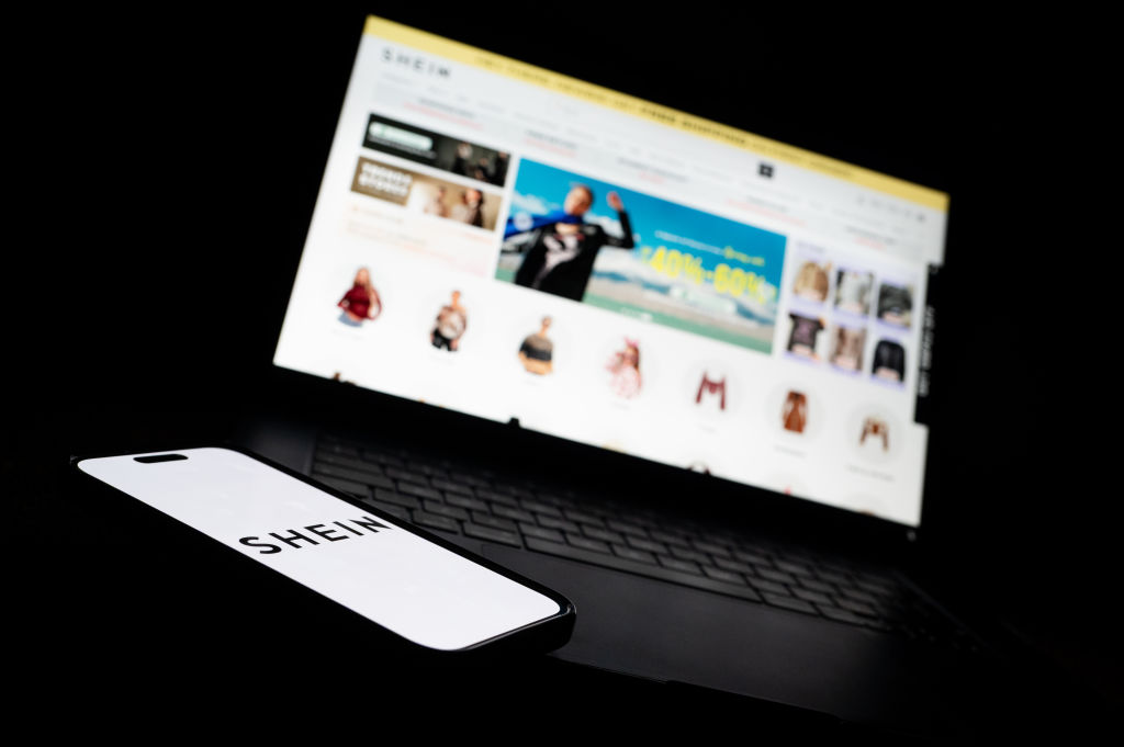 Italy's competition watchdog (AGCM) said August 4 it has fined the company responsible for Shein's websites in Europe €1 million for false and confusing claims about the e-commerce giant's efforts to be environmentally "green". (Photo Illustration by Ben Montgomery/Getty Images)