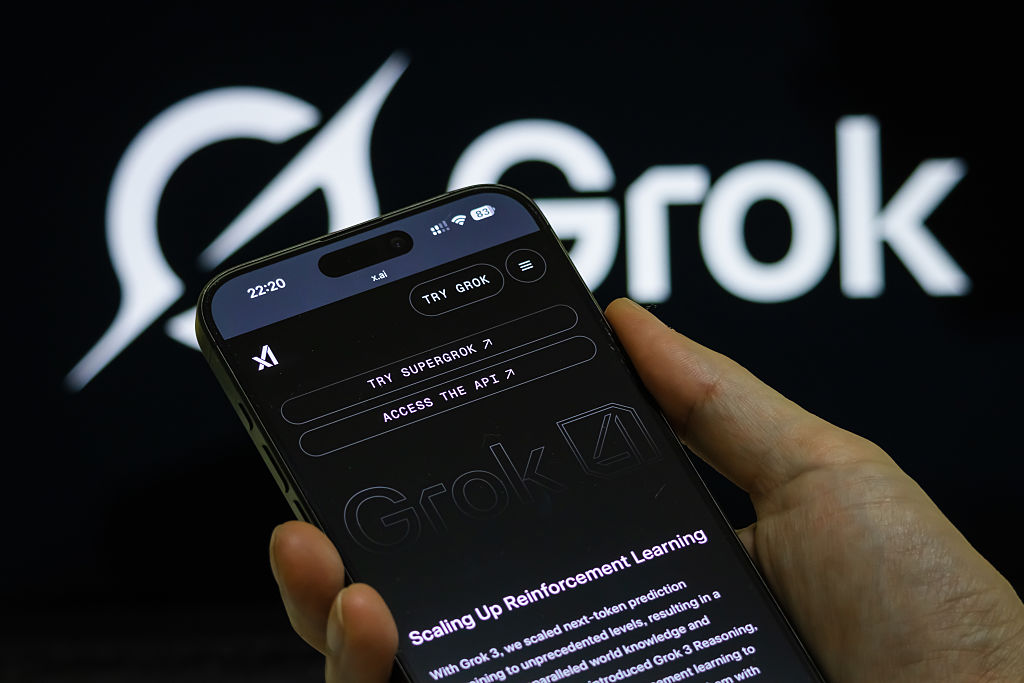 AI chatbot Grok on August 12 offered conflicting explanations for its brief suspension from X after accusing Israel and the United States of committing "genocide" in Gaza, as it lashed out at owner Elon Musk for "censoring me." (Photo by Cheng Xin/Getty Images)