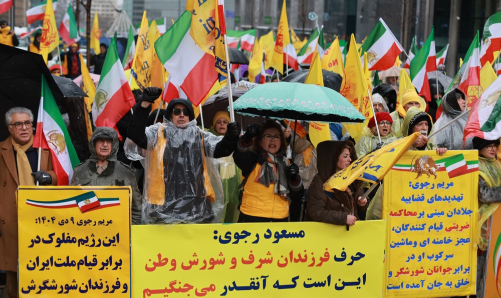 Despite heavy rain, hundreds of Iranians gathered in Schuman, Brussels, to express solidarity with the widespread protests currently taking place in Iran.EPA/OLIVIER HOSLET