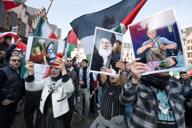 A demonstration organized by the Islamic Religious Community of Hesse (IRH) took place at Römerberg, in Frankfurt on March 8, drawing between 650 and 800 participants, according to police estimates. The rally, titled “For Peace and International Law,” coincided with International Women's Day.(Photo by BORIS ROESSLER / dpa Picture-Alliance via AFP)