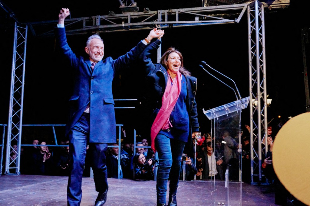 Emmanuel Gregoire, newly elect mayor of Paris celebrating with Anne Hidalgo, the previous mayor (Photo by Adnan Farzat / NurPhoto via AFP)