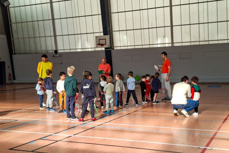 Children participate in an introductory tennis lesson in Paris (Photo by Riccardo Milani / Hans Lucas via AFP)
