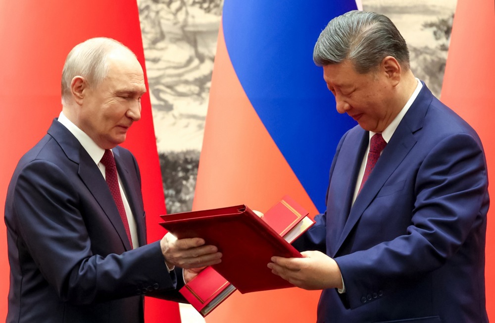 Putin meets Xi in Beijing days after Trump visit