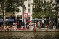 Video shows Paris sanitation worker pushing garbage into canal open for public swimming