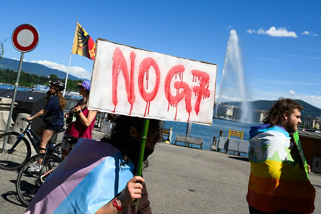 Riot police clash with protesters in Geneva