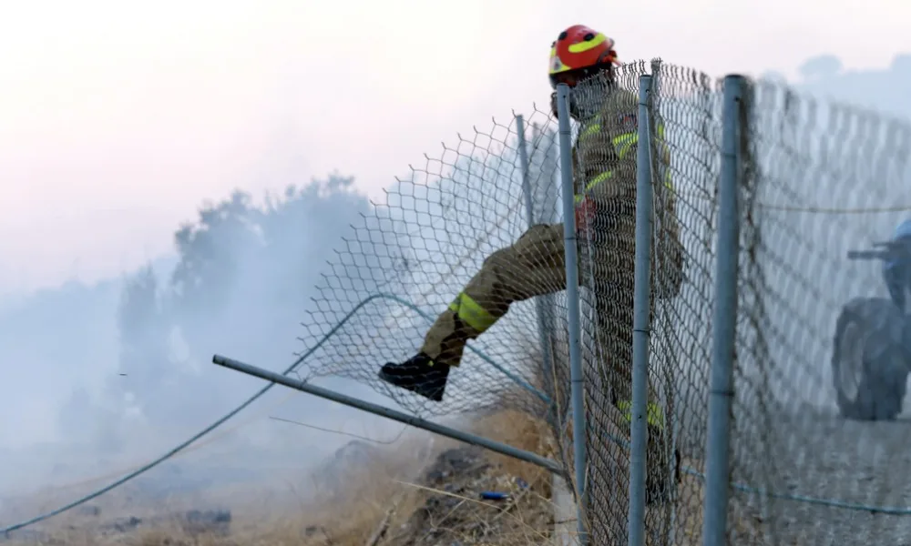 Three firefighters die in Greek wildfires as EU warns blazes are moving east