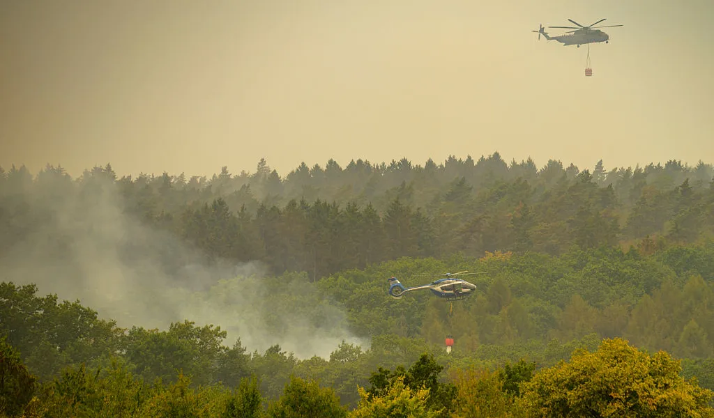 Belgium’s record wildfire stops short of German border but is not yet contained