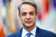 Mitsotakis promises tax cuts and higher wages as Greeks protest over living costs