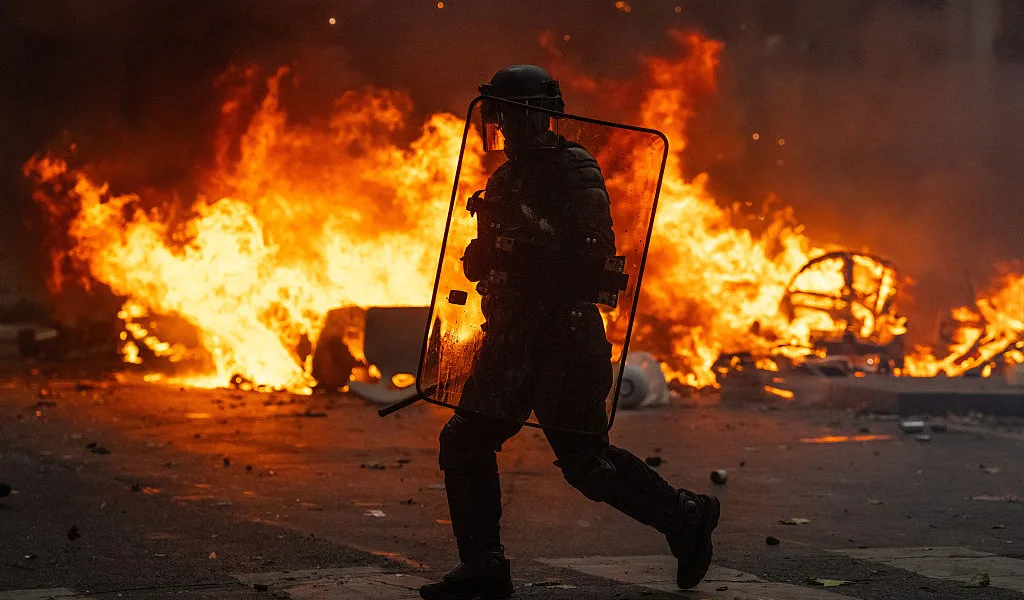France extends city curfews after first calm night since riots
