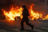 France extends city curfews after first calm night since riots