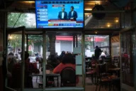 Turkish police raid pro-opposition Halk TV and halt broadcasts as trustee takes over