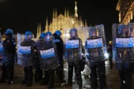 Rioters loot shops and attack police in Milan for a second night