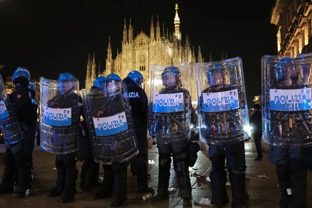 Rioters loot shops and attack police in Milan for a second night